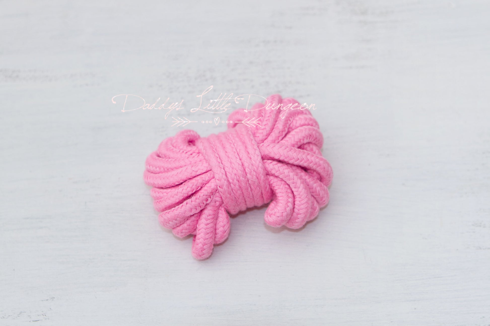 Cute pink BDSM rope for bondage, rope bunny, pet play, petplay, DDLG, and Shibari.